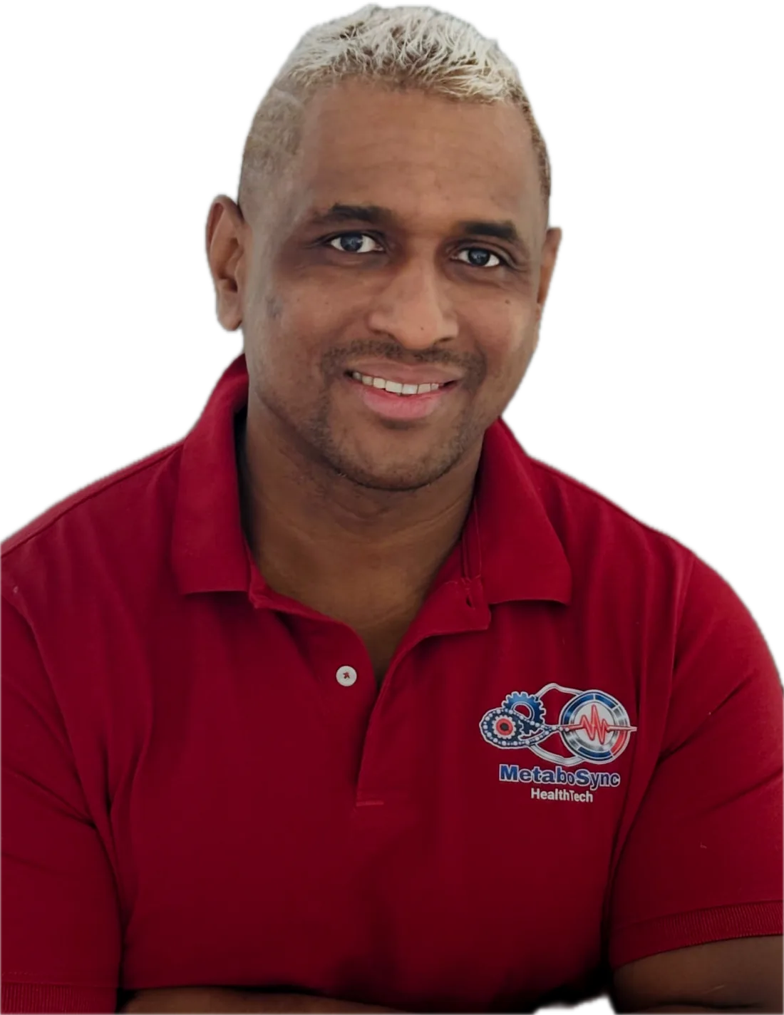 Coach Flédéric Payet in a red MetaboSync polo, arms crossed, smiling.